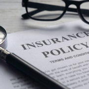 Life Insurance Policy with Magnifying Glass