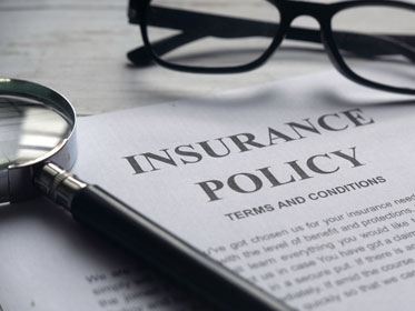 Life Insurance Policy with Magnifying Glass