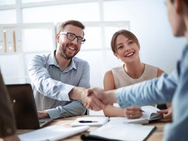 clients shaking hands with advisor