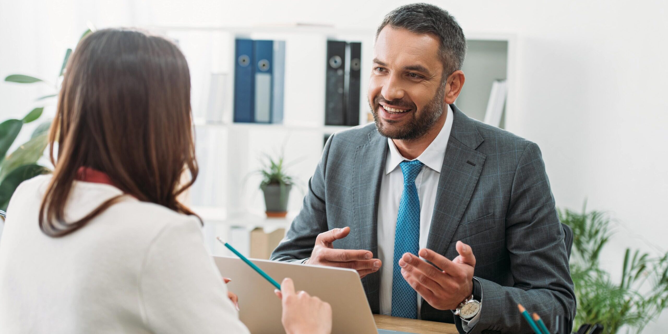 Man in business suit talking with a client
